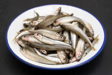 Wall Mural - small fish in white plate