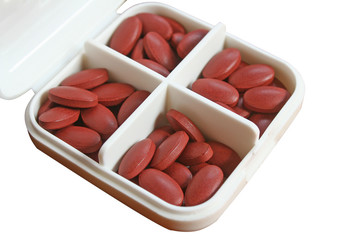 Wall Mural - Vitamin and medication tablets in white box,nourishing blood after donating blood isolated on white background