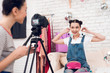 © freeograph - Two fashion blogger girls hold up colorful jewelry with one girl behind camera.