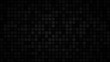 Abstract dark background of small squares or pixels in shades of black and gray colors.