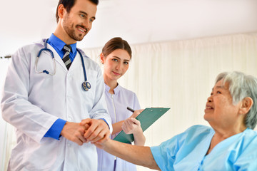 Wall Mural - Concept of healing care, The doctor is healing  old woman.