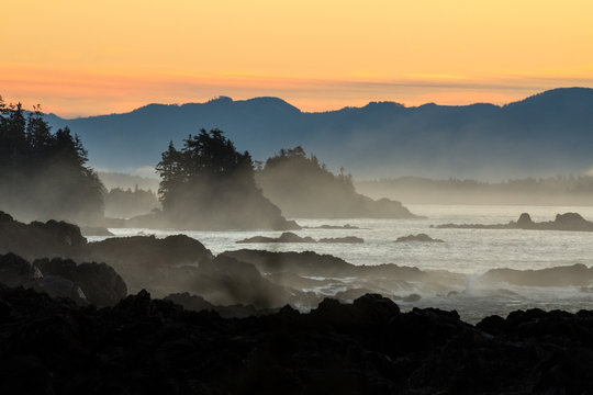 dramatic dawn over rocky coast of vancouver island.