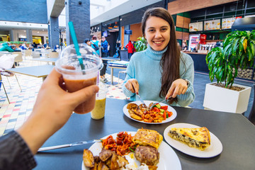 couple sit in mall cafe and having dinner. lifestyle. date in cafe