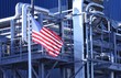 © Amanda - American Flag flying in front of manufacturing factory