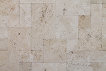 Natural Italian Stone. Smooth Travertine Surface. A Sample Of Wall Cladding With Natural Stone.	