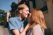 © blackbirdua - young and beautiful guy and girl kiss each other on the street
