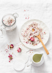 Wall Mural - homemade edible coconut rose sugar scrub on light background, top view. making home product cosmetic