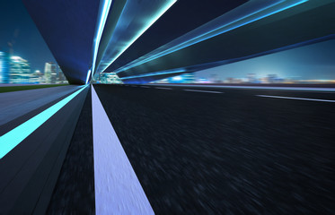 Wall Mural - Abstract motion blur effect fast forward moving asphalt tunnel road .