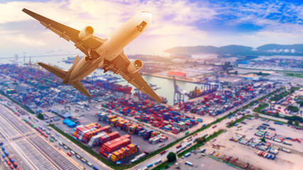 Wall Mural - Logistics and transportation of container cargo ship and cargo plane with working crane bridge in shipyard at summer day, logistic import export and transport industry concept.