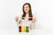 © ViDi Studio - Young woman at table with green, red, yellow detox smoothies in bottles, measure tape isolated on white background. Proper nutrition, vegetarian drink, healthy lifestyle, dieting concept. Copy space.