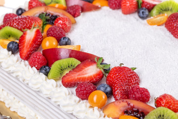 Wall Mural - Fruit cream cake with strawberries on a birthday girl.