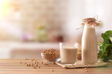 Wall Mural - Reptientes with soy milk and grains in rustic kitchen background