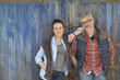 © goodluz - Couple of farmers standing in front of barn wooden door