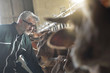 © goodluz - Farmer in barn checking on livestock
