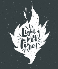 Vector flame with lettering and grunge texture. Light my fire. Burning bonfire silhouette with motivation quote and sparks. Illustration or background with space for your text.