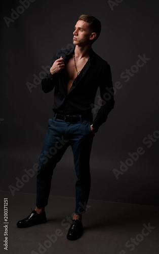 black shirt with dark blue pants