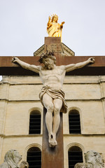 Wall Mural - Crucifix and golden statue of Madonna looking from the top of Notre Dame Cathedral. Avignon (France) 