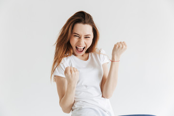 Wall Mural - Happy woman in t-shirt screaming and rejoices