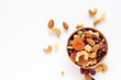 © p-fotography - healthy snack: mixed nuts and dried fruits in wooden bowl on white background, almond, pineapple, cranberry, papaya, apple, strawberry, cherry, apricot, casshew.