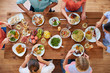 © Syda Productions - eating and leisure concept - group of people having dinner at table with food