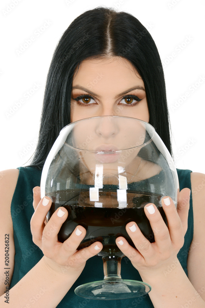 Close up of young woman holding a giant glass of wine Stock Photo | Adobe  Stock