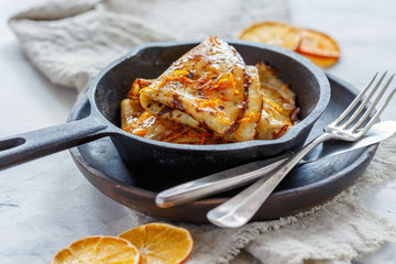 Crepe Suzette with orange sauce.