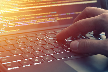 Closeup coding on screen, hands coding html and programming on screen laptop, web development, developer