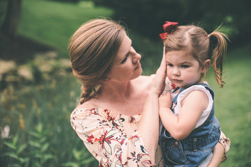 loving mother comforting daughter