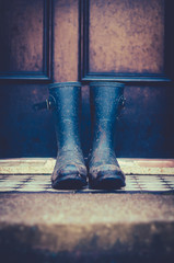 Muddy Wellington Boots on Doorstep