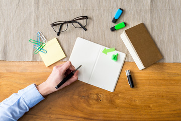 Wall Mural - Empty notebook with copy space and hand as flat lay and template