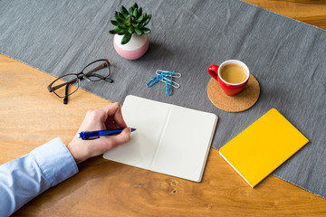 Wall Mural - Empty notebook with copy space and hand as flat lay and template