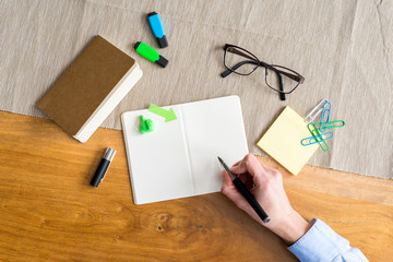 Wall Mural - Empty notebook with copy space and hand as flat lay and template