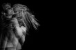 Emotional mystical dramatic female portrait in motion on a black background. triple exposure. Black and white photo