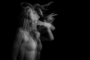 Wall Mural - Dramatic Mystical sensitive emotional portrait of a young girl in motion. Black and white photo. triple exposure.