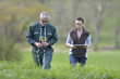 © goodluz - Farmer with agronomist walking in agricultural field