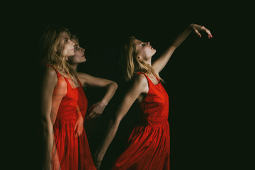 Wall Mural - Dancing in the dark woman soul in red dress on black background. triple exposure. conceptual original dramatic creative emotional photo metaphor