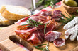 Antipasto delicatessen - sliced meat, ham, salami and olives on 