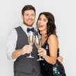 © Syda Productions - celebration and holidays concept - happy couple with glasses drinking non alcoholic champagne at party