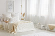 © Photographee.eu - Beige blanket on white bed