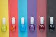 nail polish of different colors on a colored background