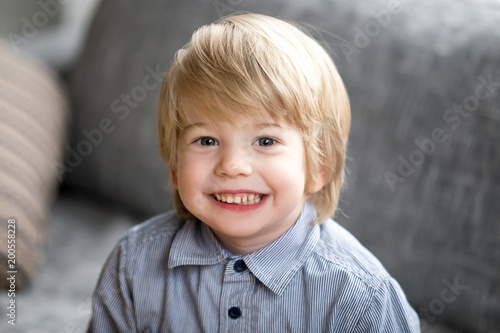 Head Shot Of Cute Little Boy Happy Funny Child With Blond Light