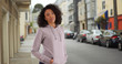 © rocketclips - Calm African-American girl in her 20s wearing hoodie outside in European street