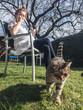 © Alexander - cat hanging in the garden with young woman