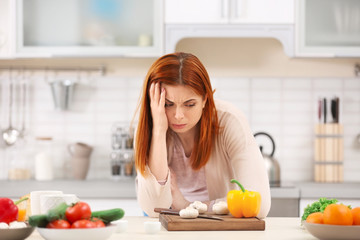 Poster - Tired housewife cooking in kitchen