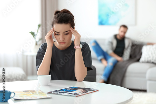 Cuadros en Lienzo Young couple ignoring each other after having argument in living room