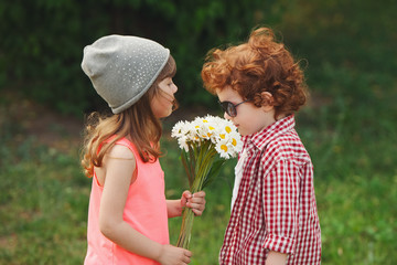 Wall Mural - hipster boy and girl in park