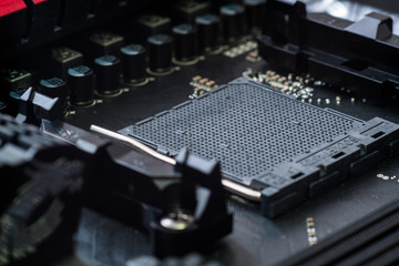 CPU socket and processor on the motherboard. Focus on the motherboard. Toned image