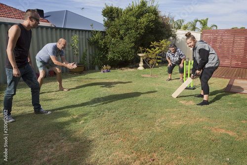 A Family Playing A Traditional Game Of Back Yard Cricket Buy
