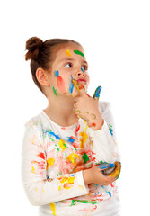 Canvas Print - Pensive girl with hands and face full of paint isolated on a white background