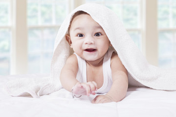 Wall Mural - Joyful baby boy in the bedroom